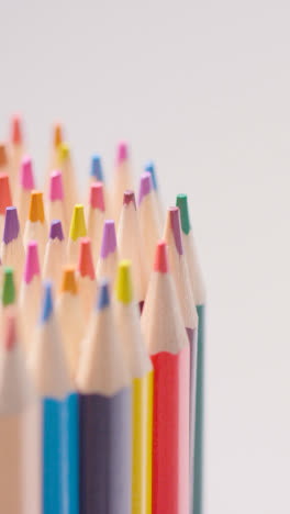 Vertical-Video-Studio-Shot-Of-Rotating-Multi-Coloured-Pencils-Against-White-Background-2